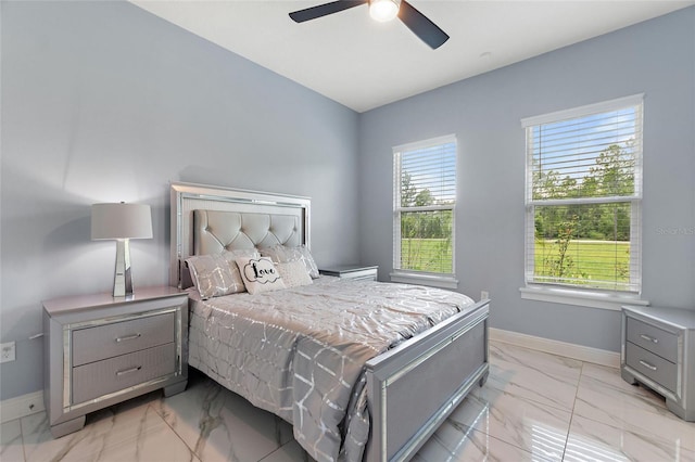 1702 Hidden Palms Dr, Davenport, FL 33897 - bedroom with light marble finish floors and ceiling fan