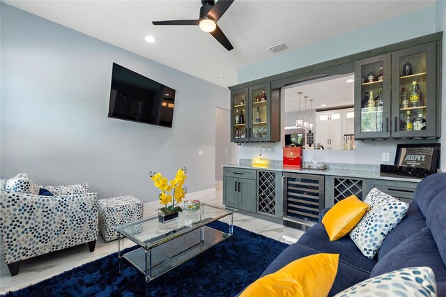 1702 Hidden Palms Dr, Davenport, FL 33897 - living room featuring beverage cooler, a ceiling fan, light marble finish floors, and recessed lighting