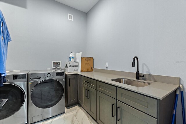 1702 Hidden Palms Dr, Davenport, FL 33897 - laundry area with independent washer and dryer, cabinet space, and light marble finish flooring