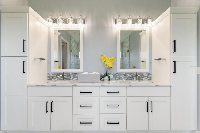 1702 Hidden Palms Dr, Davenport, FL 33897 - full bathroom featuring a marble finish shower, double vanity, and backsplash