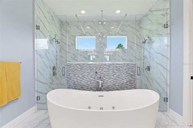 1702 Hidden Palms Dr, Davenport, FL 33897 - bathroom featuring marble finish flooring, a soaking tub, a marble finish shower, and recessed lighting