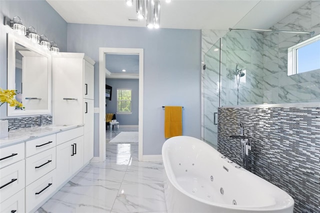 1702 Hidden Palms Dr, Davenport, FL 33897 - full bathroom with a jetted tub, a marble finish shower, marble tiled flooring, and healthy amount of natural light
