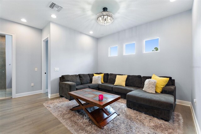 1702 Hidden Palms Dr, Davenport, FL 33897 - living area featuring light wood finished floors, a chandelier, and recessed lighting