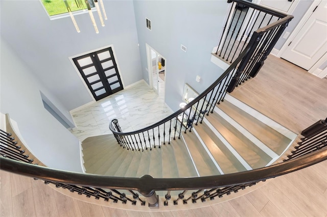 1702 Hidden Palms Dr, Davenport, FL 33897 - stairs featuring french doors and a towering ceiling