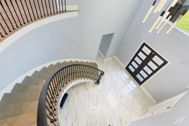 1702 Hidden Palms Dr, Davenport, FL 33897 - staircase with a towering ceiling and baseboards