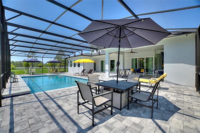 1702 Hidden Palms Dr, Davenport, FL 33897 - outdoor pool featuring a patio area, ceiling fan, a lanai, and outdoor dining area