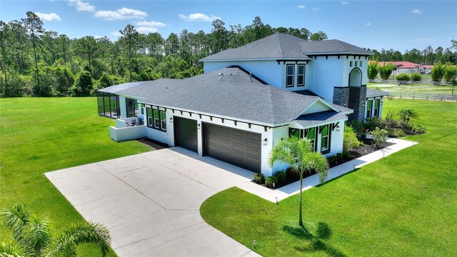 1702 Hidden Palms Dr, Davenport, FL 33897 - view of front of property with a shingled roof, stucco siding, a garage, and concrete driveway