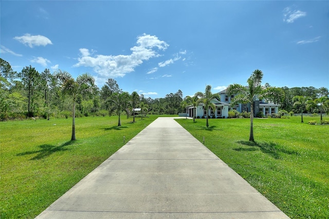 1702 Hidden Palms Dr, Davenport, FL 33897 - view of home's community with a yard and concrete driveway