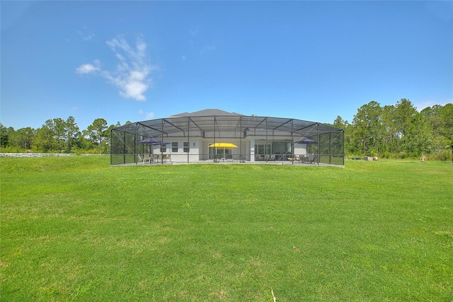 1702 Hidden Palms Dr, Davenport, FL 33897 - back of property featuring a yard and a lanai