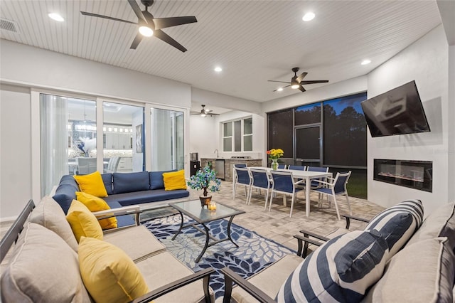 1702 Hidden Palms Dr, Davenport, FL 33897 - living room with a ceiling fan and recessed lighting