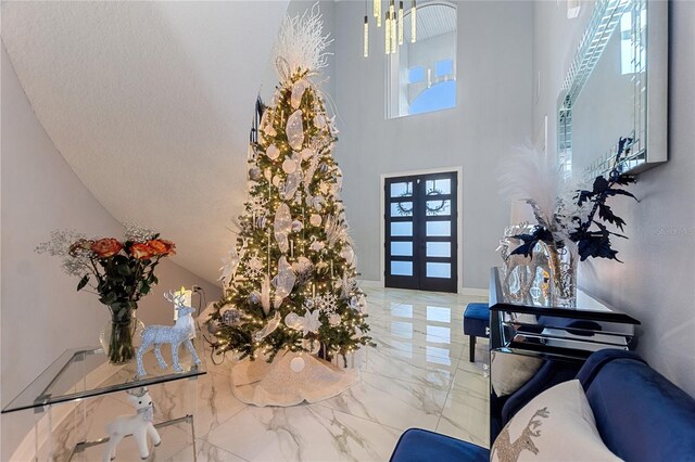 1702 Hidden Palms Dr, Davenport, FL 33897 - entrance foyer featuring marble tiled floors, a towering ceiling, and french doors