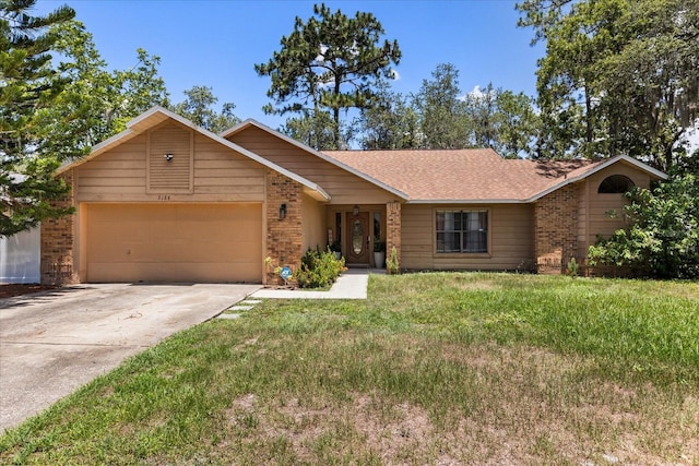 3184 Maltby Dr, Deltona, FL 32738 - ranch-style home with brick siding, a garage, concrete driveway, a front lawn, and roof with shingles