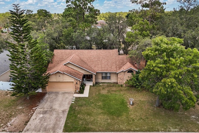 3184 Maltby Dr, Deltona, FL 32738 - ranch-style home with a garage, concrete driveway, and brick siding