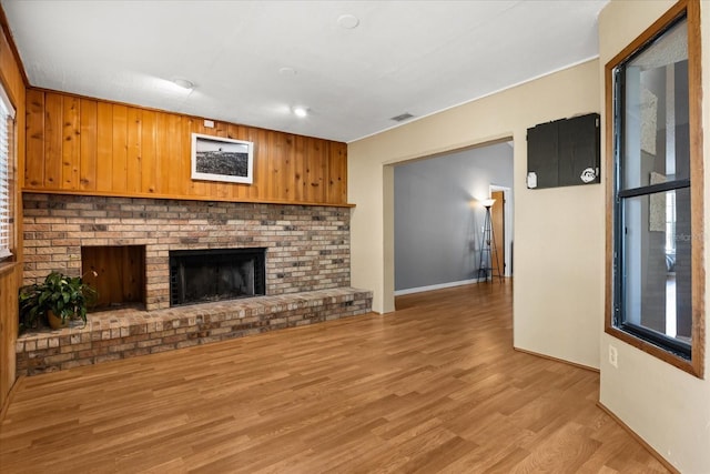3184 Maltby Dr, Deltona, FL 32738 - unfurnished living room featuring light wood finished floors and a fireplace