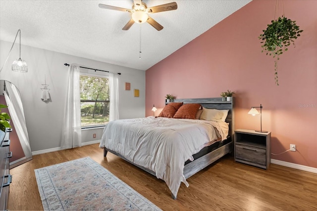 3184 Maltby Dr, Deltona, FL 32738 - bedroom featuring a textured ceiling, wood finished floors, vaulted ceiling, and a ceiling fan