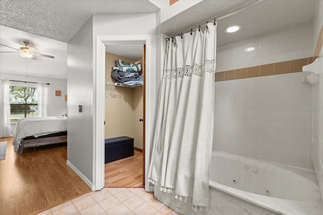3184 Maltby Dr, Deltona, FL 32738 - ensuite bathroom with a ceiling fan, a combined bath / shower with jetted tub, tile patterned flooring, and recessed lighting