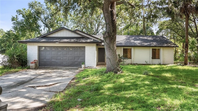 15925 Summit Ct, Clermont, FL 34711 - single story home with concrete driveway, a front yard, an attached garage, and brick siding