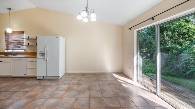 15925 Summit Ct, Clermont, FL 34711 - kitchen with white appliances, lofted ceiling, open shelves, a chandelier, and decorative light fixtures