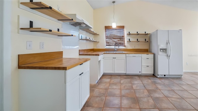 15925 Summit Ct, Clermont, FL 34711 - kitchen with open shelves, white appliances, wood counters, white cabinets, and vaulted ceiling