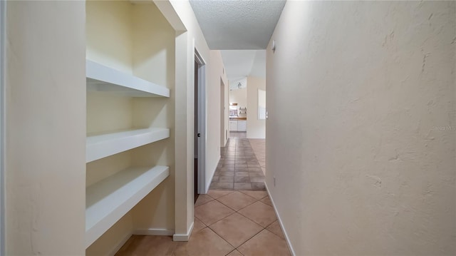15925 Summit Ct, Clermont, FL 34711 - hall with light tile patterned floors and a textured ceiling