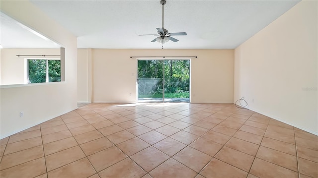 15925 Summit Ct, Clermont, FL 34711 - spare room with plenty of natural light, light tile patterned floors, and a ceiling fan