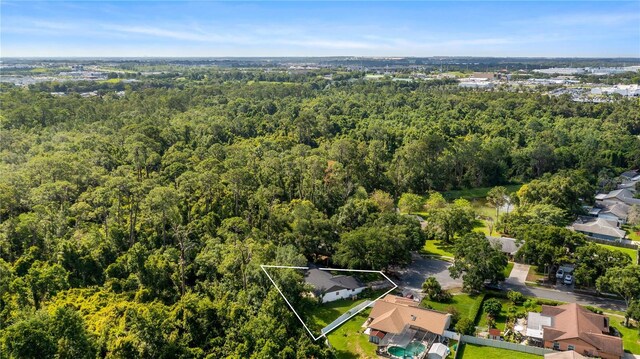15925 Summit Ct, Clermont, FL 34711 - aerial perspective of suburban area with a forest and property boundaries highlighted