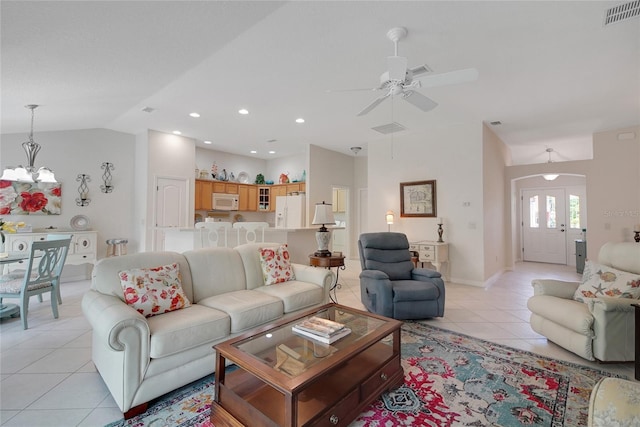2369 Unity Ter, The Villages, FL 32162 - living room featuring light tile patterned floors, arched walkways, a chandelier, lofted ceiling, and ceiling fan