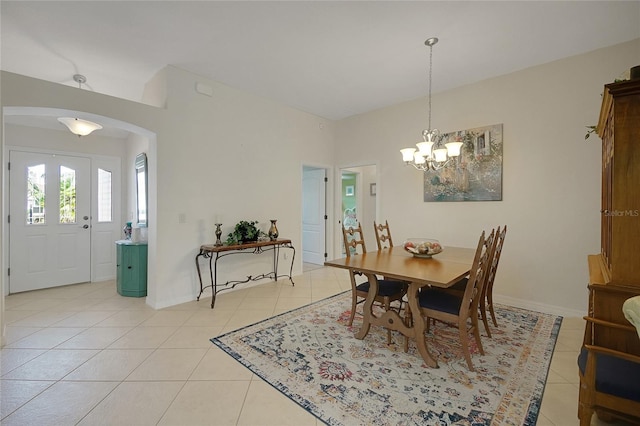 2369 Unity Ter, The Villages, FL 32162 - dining space featuring light tile patterned floors, arched walkways, and a chandelier