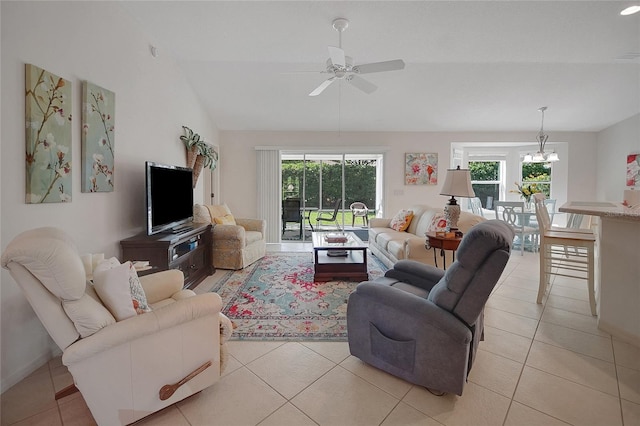 2369 Unity Ter, The Villages, FL 32162 - living area with a ceiling fan, vaulted ceiling, plenty of natural light, and light tile patterned flooring