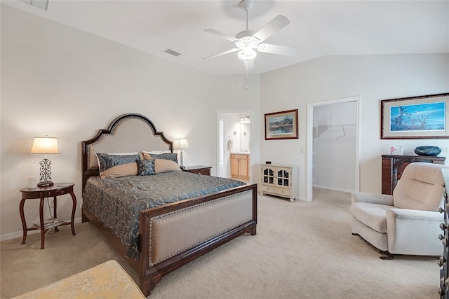 2369 Unity Ter, The Villages, FL 32162 - bedroom featuring light carpet, lofted ceiling, a spacious closet, a closet, and ensuite bath