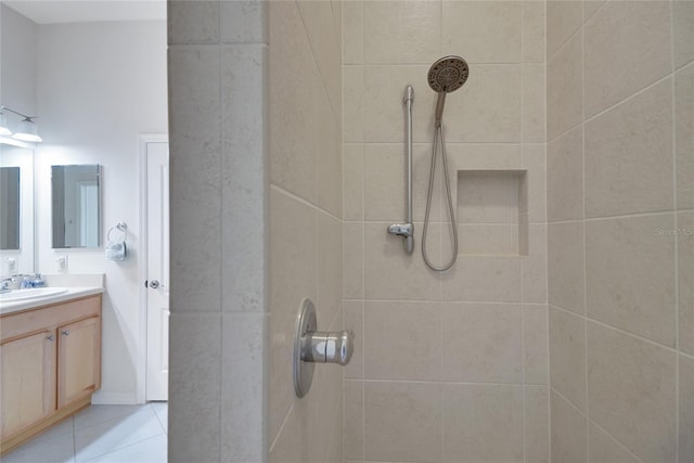 2369 Unity Ter, The Villages, FL 32162 - bathroom featuring tiled shower, vanity, and tile patterned flooring