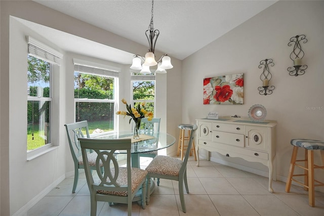 2369 Unity Ter, The Villages, FL 32162 - dining room featuring a chandelier, vaulted ceiling, plenty of natural light, light tile patterned floors, and a textured ceiling