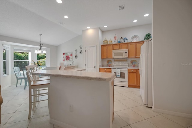 2369 Unity Ter, The Villages, FL 32162 - kitchen with white appliances, light countertops, a chandelier, vaulted ceiling, and light tile patterned floors