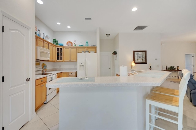 2369 Unity Ter, The Villages, FL 32162 - kitchen featuring white appliances, light tile patterned floors, light countertops, glass insert cabinets, and recessed lighting