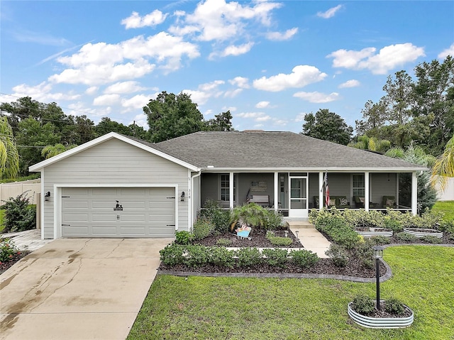 318 Stone Castle Loop, Lady Lake, FL 32159 - view of front of property with a porch, a front yard, driveway, a garage, and roof with shingles