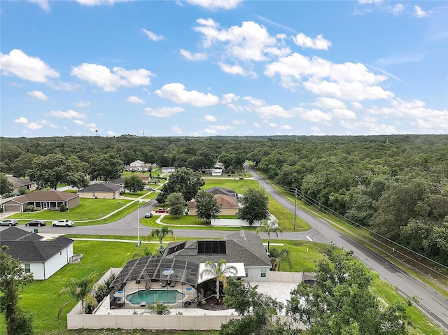 318 Stone Castle Loop, Lady Lake, FL 32159 - aerial perspective of suburban area featuring a heavily wooded area and a pool