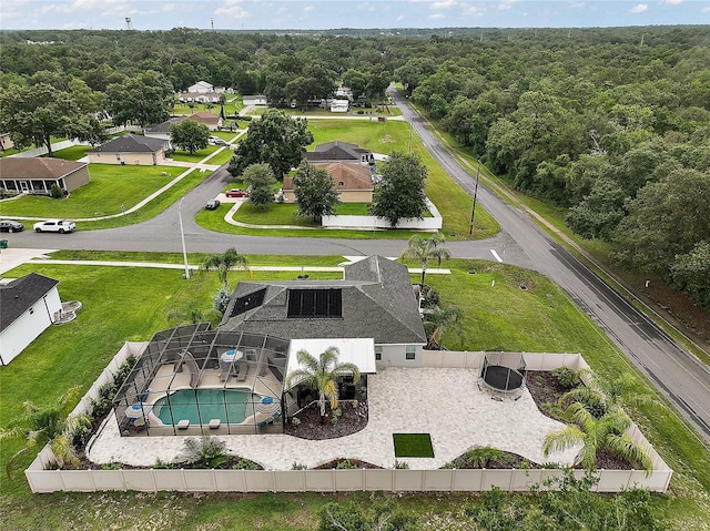 318 Stone Castle Loop, Lady Lake, FL 32159 - aerial view of a pool area and a heavily wooded area