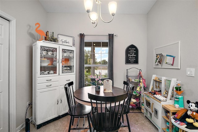 318 Stone Castle Loop, Lady Lake, FL 32159 - dining space featuring a chandelier and light wood-style flooring