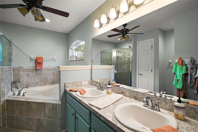 318 Stone Castle Loop, Lady Lake, FL 32159 - bathroom with a ceiling fan, a stall shower, a garden tub, and double vanity