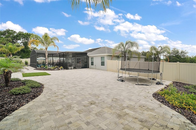 318 Stone Castle Loop, Lady Lake, FL 32159 - view of home's community with a trampoline and a patio area