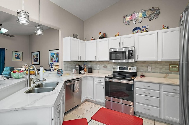 4300 Leafway Cir, Leesburg, FL 34748 - kitchen featuring stainless steel appliances, backsplash, and white cabinetry