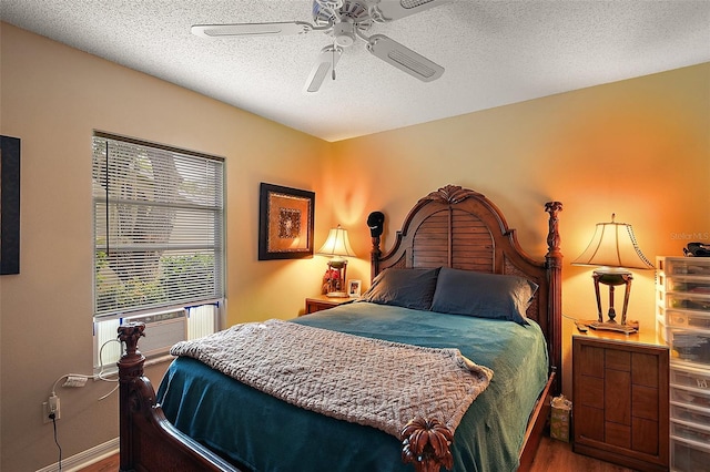 4300 Leafway Cir, Leesburg, FL 34748 - bedroom featuring wood finished floors, a textured ceiling, and a ceiling fan