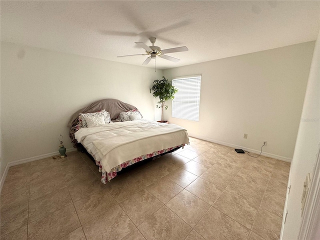 17483 SE 74th Netherclift Ter, The Villages, FL 32162 - bedroom featuring light tile patterned flooring, ceiling fan, and a textured ceiling