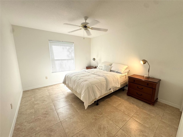 17483 SE 74th Netherclift Ter, The Villages, FL 32162 - bedroom featuring light tile patterned floors and ceiling fan