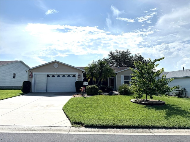 17483 SE 74th Netherclift Ter, The Villages, FL 32162 - ranch-style house with driveway, a front lawn, and an attached garage