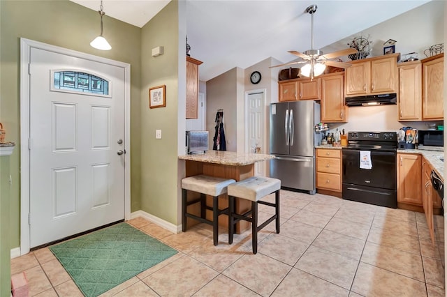 1511 W Magnolia St, Clermont, FL 34711 - kitchen featuring appliances with stainless steel finishes, under cabinet range hood, lofted ceiling, light tile patterned floors, and ceiling fan