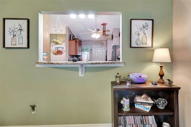 1511 W Magnolia St, Clermont, FL 34711 - detailed view of freestanding refrigerator and ceiling fan