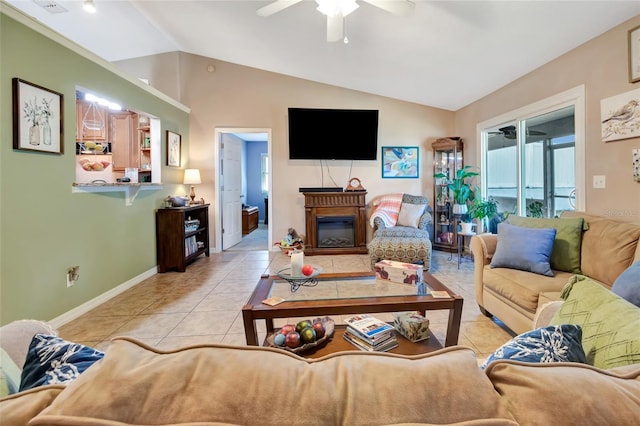 1511 W Magnolia St, Clermont, FL 34711 - living room with lofted ceiling, ceiling fan, light tile patterned floors, and a glass covered fireplace