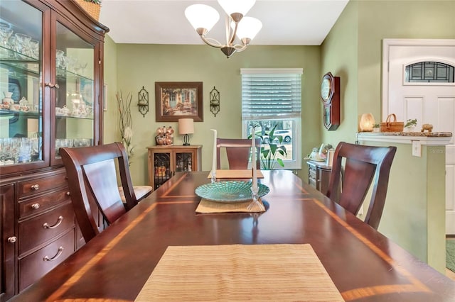1511 W Magnolia St, Clermont, FL 34711 - dining area featuring a chandelier