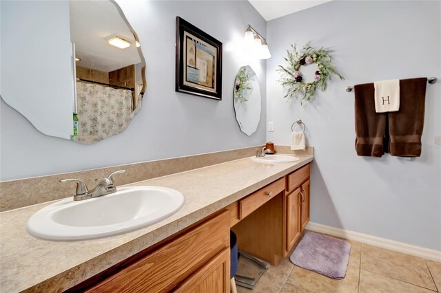 1511 W Magnolia St, Clermont, FL 34711 - bathroom featuring double vanity, tile patterned flooring, and curtained shower